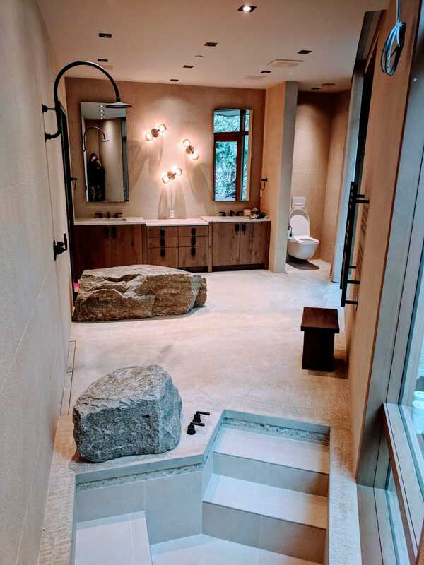 beautiful bathroom with stone bath and shower